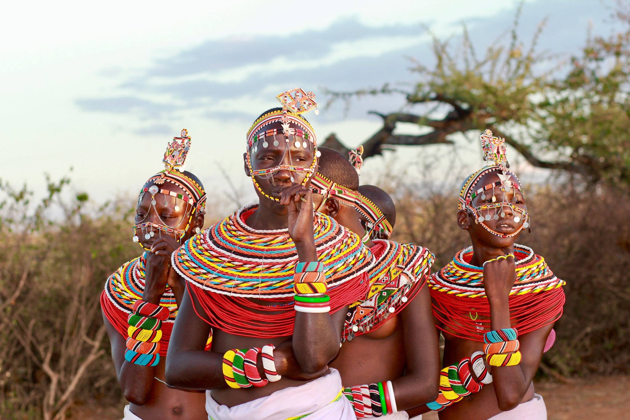 4 favorite activities in Kenya, four samburu women in extravagantly beaded collars and headdress.