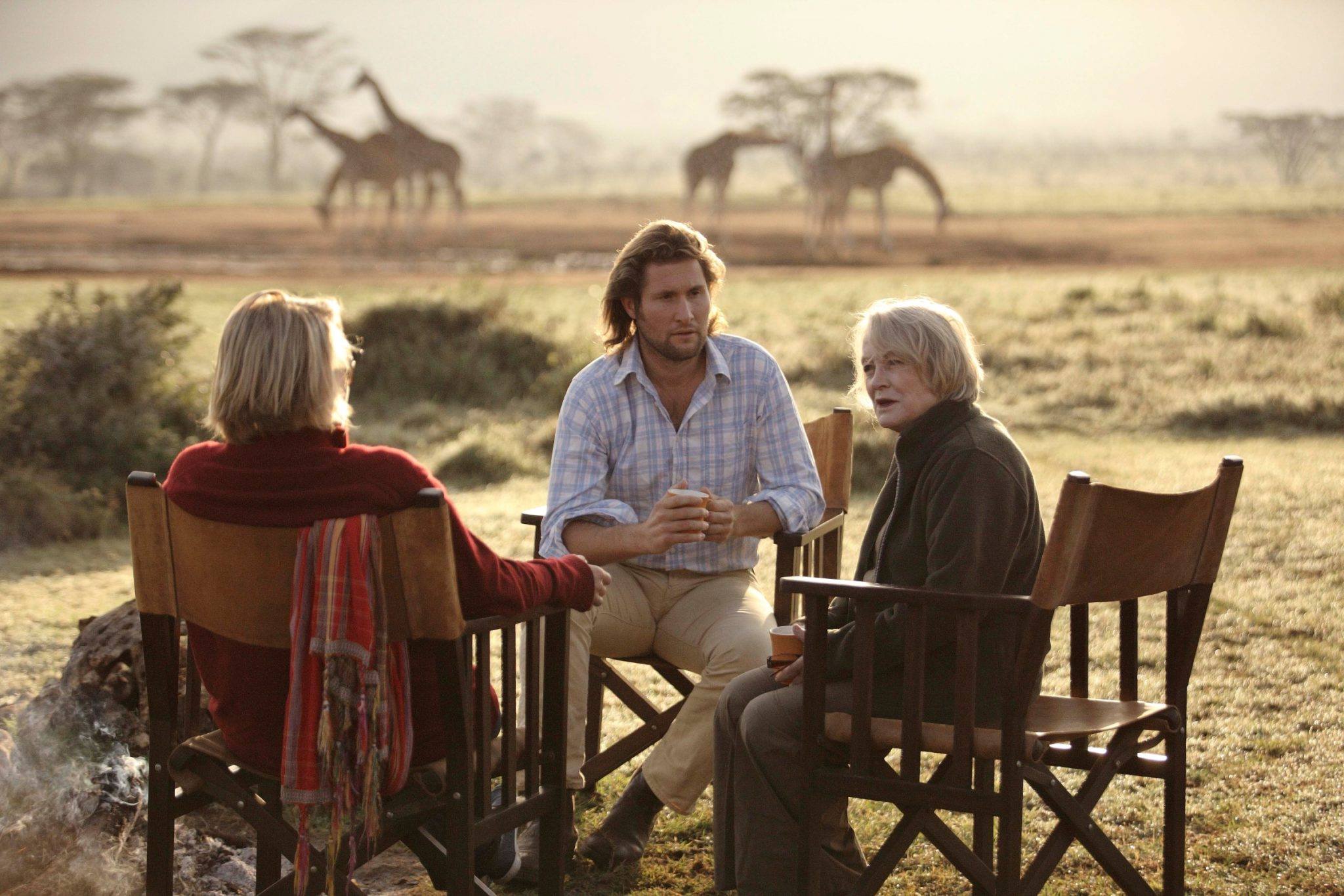 9 Perfect Properties for a Multigenerational Safari, A family enjoys quality time together as wildlife roams on the plains that surround Enasoit Camp. ©Enasoit Camp
